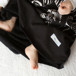 Cozy Basics Sleep Bag Black / Zebras baby with feet out the bottom